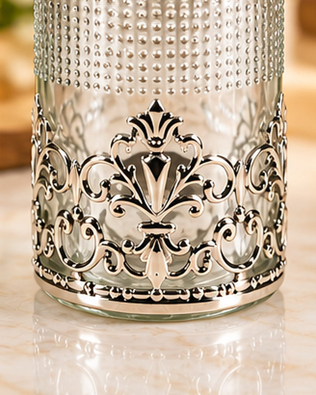 Detail of the lower filigree band against the hobnailed glass