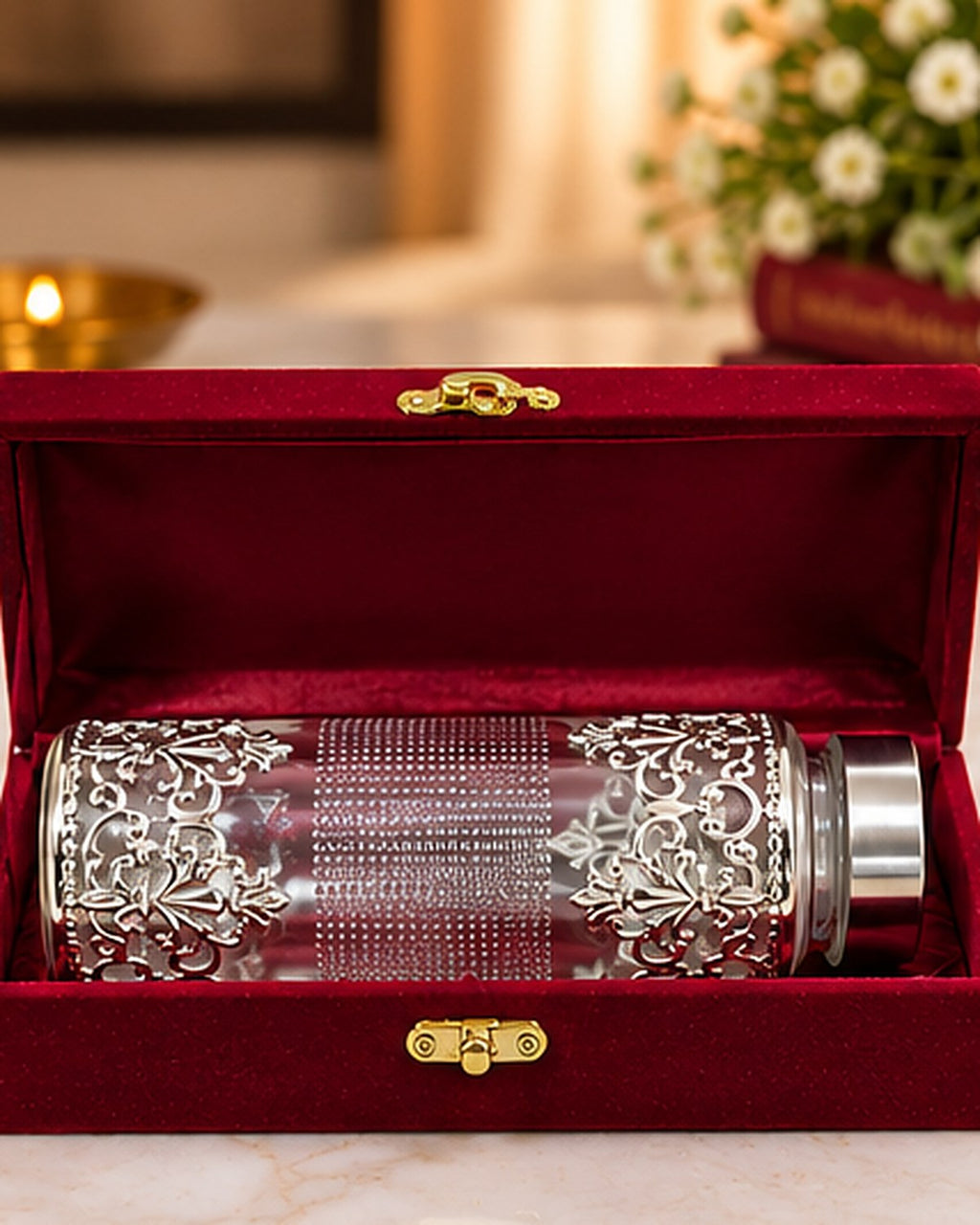 Filigree water bottle packed in a red velvet gift box with a brass clasp