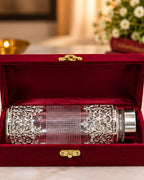 Filigree water bottle packed in a red velvet gift box with a brass clasp