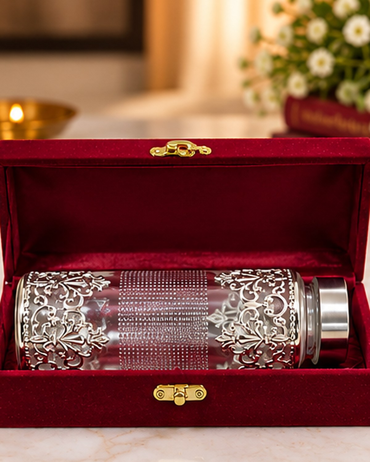 Filigree water bottle packed in a red velvet gift box with a brass clasp