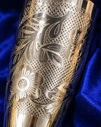 Hand-engraved floral band on the German Silver bowl over a cross-hatched ground