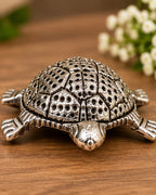 Close view of the German Silver tortoise shell, showing the chased dot pattern