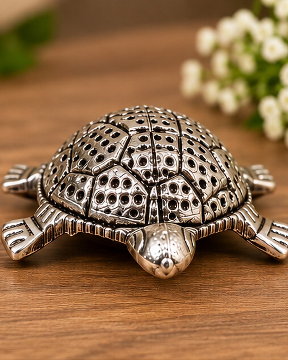 Close view of the German Silver tortoise shell, showing the chased dot pattern