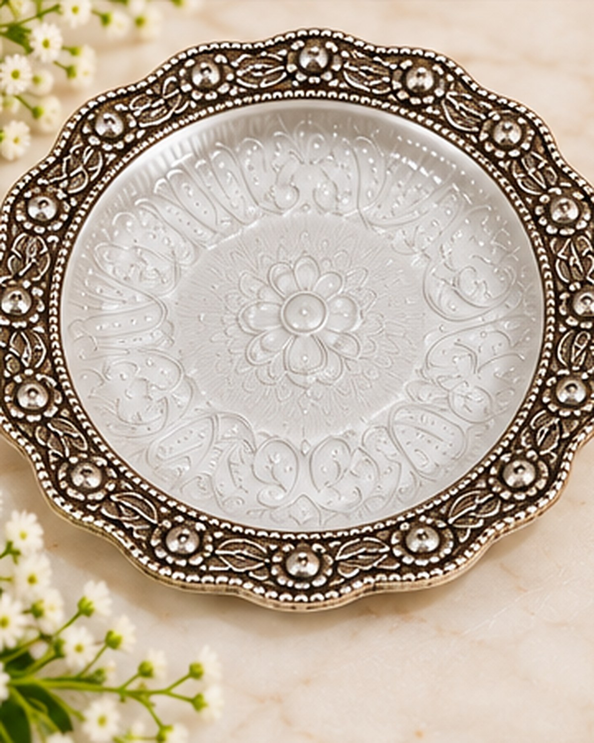 Six inch German Silver pooja plate with an embossed lotus centre and beaded rim
