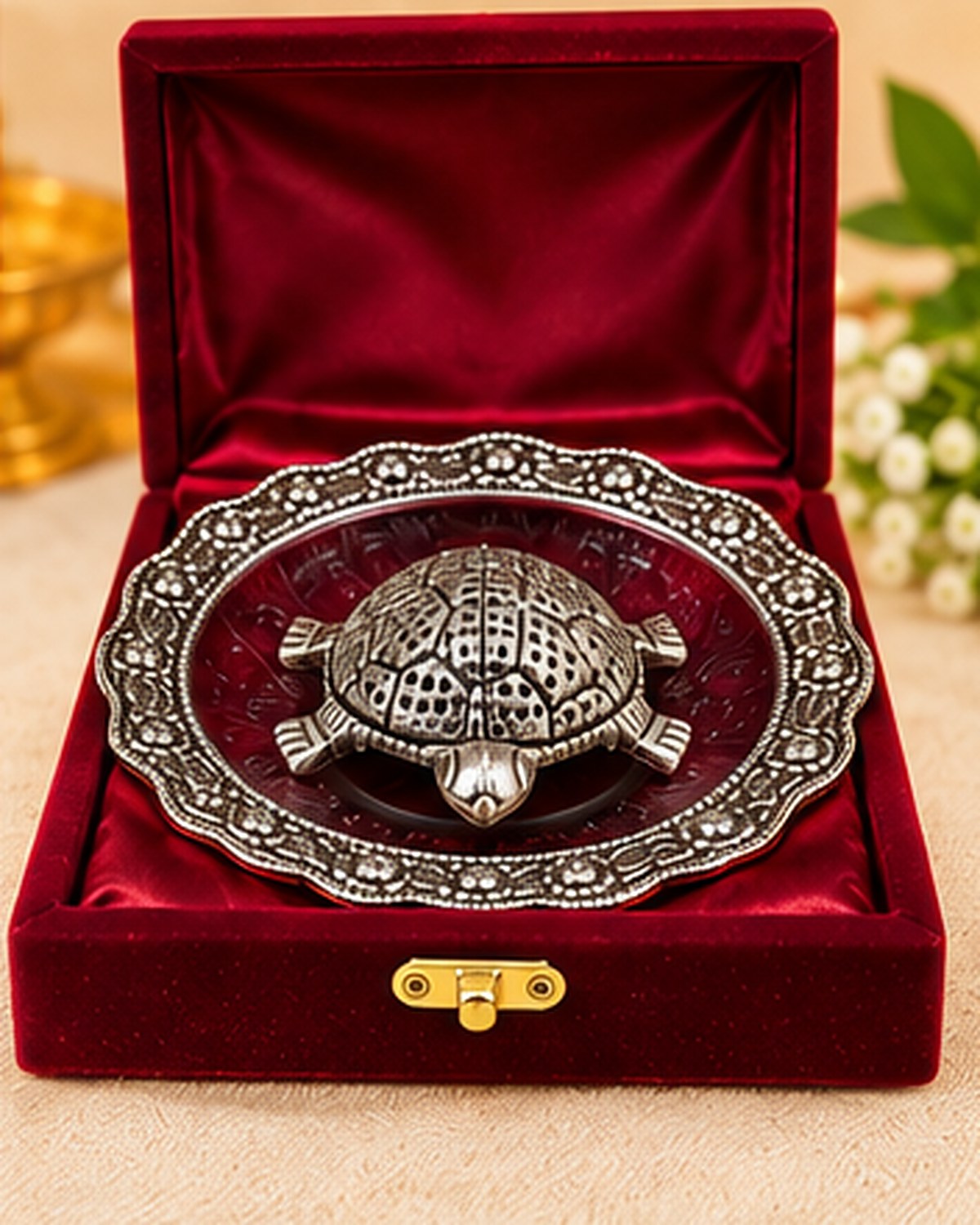 Kurma tortoise and plate packed in a red velvet gift box with a brass clasp