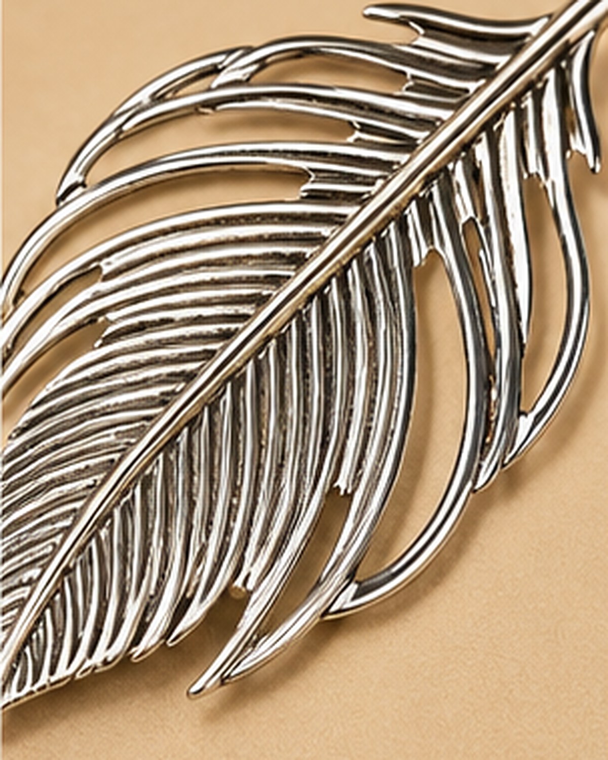 Open feather sindoor pin in German Silver, barbs pierced right through